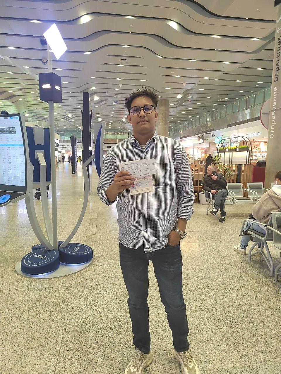 Student with his travel documents at the airport, admitted to Saint Petersburg State Forest Technical University