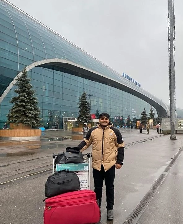 Student arriving at Moscow Domodedovo Airport with luggage